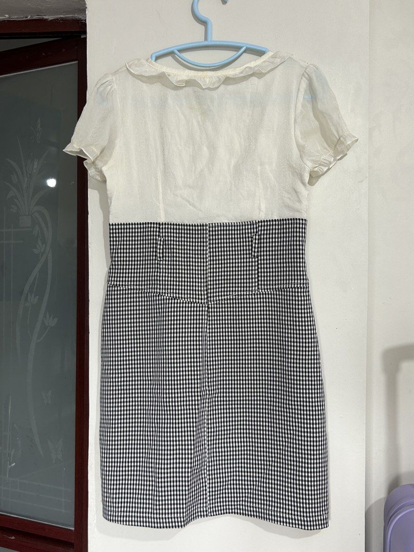 White and Black Gingham Ruffle Dress (Category: Dresses) located in Pasig City. Submitted by eddwuhrd (Listing ID 1470167462, Image 2). Description: - Style: Short sleeve dress with white ruffled top and black-and-white gingham skirt - Closure: Half-zip front with sparkling rhinestone details along the zipper teeth - Design: High waist cut with decorative button accents down the front - Size: L (165/88A) - Condition: Excellent, ready to wear.