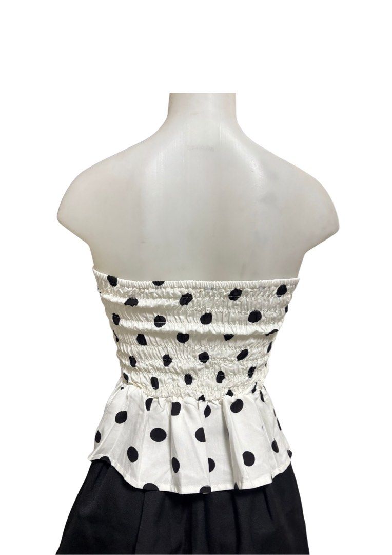 White Black Polka Dot Tube Top (Category: Sleeveless) located in Caloocan City. Submitted by shibowhii (Listing ID 1470225314, Image 2). Description: - Color/Pattern: White with all-over black polka dots - Fit: Structured front bodice with seams + stretchy smocked elastic back panel - Design: Flared peplum hem at the waist .