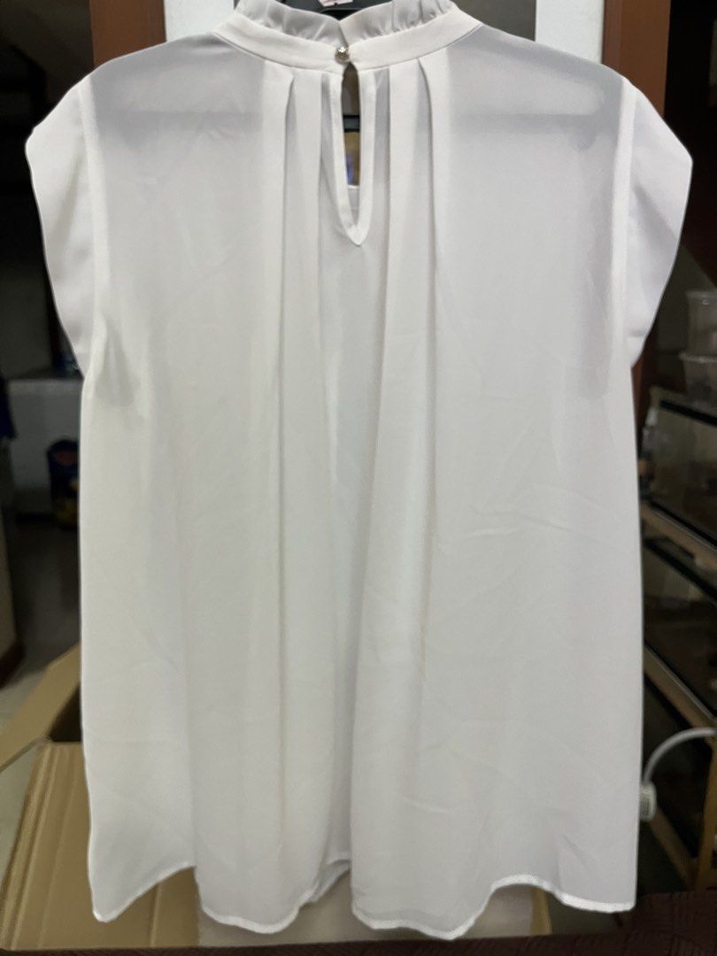 White blouse (Category: Blouses) located in Bacoor. Submitted by ayit. (Listing ID 1470267367, Image 2). Description: Orig personal japan s used - Color: White - Brand: Japan brand - Size: M (EU 38 / UK 10 / US 6) - Design: Elegant front smocked detailing and back keyhole with button closure - Condition: 4/5 (well-maintained) - Style: Lightweight, versatile, great for casual or office wear.