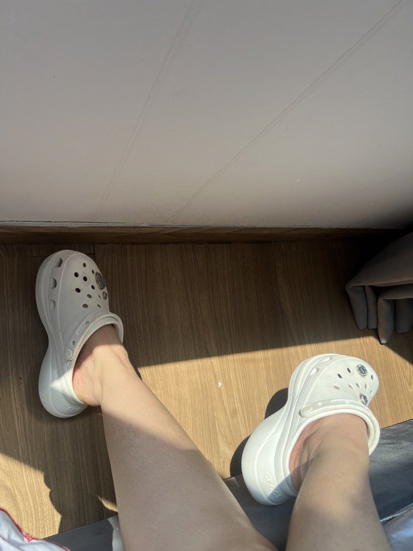 White Crocs Platform Clogs with Jibbitz Charms (Category: Slippers and slides) located in Makati City. Submitted by warm.abc123 (Listing ID 1470181141, Image 2). Description: - Authentic White Crocs Platform Clogs - Features sparkly Jibbitz charms (glittery heart and clear gems) - Classic slip-on design with extra height and iconic comfort footbed - Condition: Uppers are very clean, with minor light wear on the soles - Perfect for daily casual we