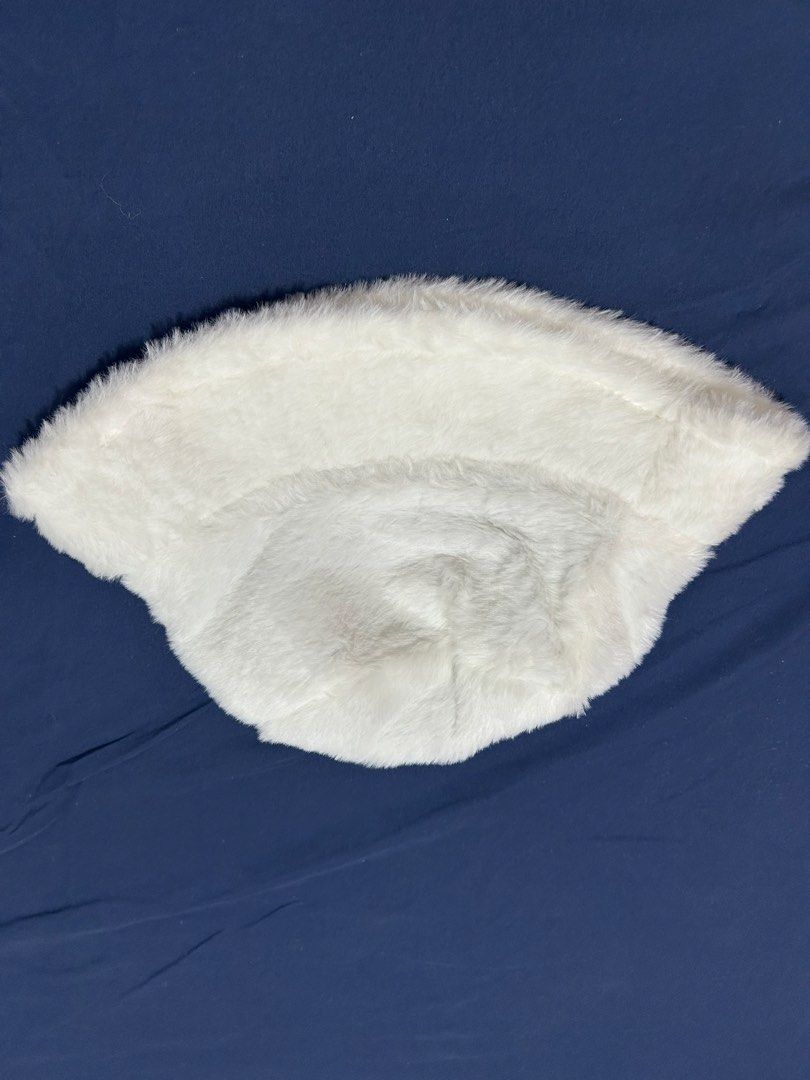 White Faux Fur Bucket Hat (Category: Hats & Beanies) located in Makati City. Submitted by aizy_sell (Listing ID 1470267318, Image 2). Description: - Color: Fluffy white with black fabric lining inside - Material: Super soft faux fur, nice and warm for winter - Size: Standard adult size - Condition: Brand new, clean, and never worn out - Features: Includes original interior tag.