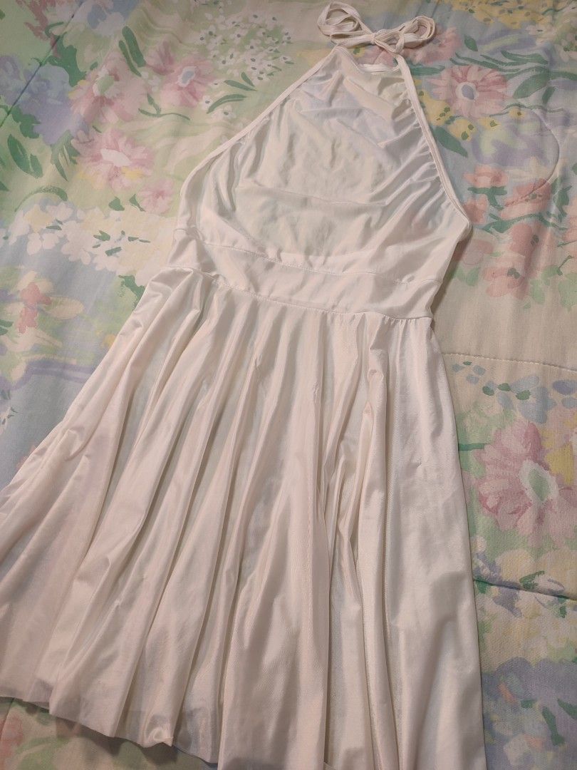 White Halter Neck Mini Satin Dress (Category: Dresses) located in Jaen. Submitted by roxantiago (Listing ID 1470192723, Image 2). Description: - Color: White - Style: Halter neck, sleeveless, fit-and-flare mini dress - Details: Deep scoop back, adjustable tie straps, and a flared skirt xs to s - Versatility: Great for casual day wear or stylish nights out.