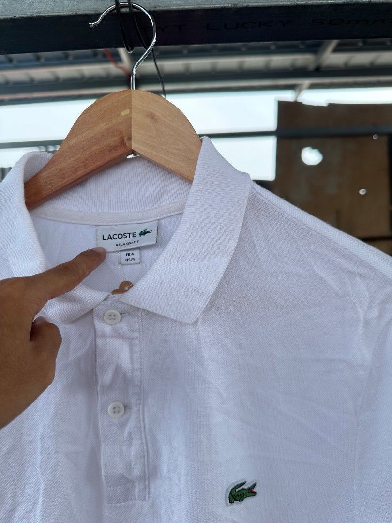 White lacoste polo shirt (Category: Tshirts & Polo Shirts ) located in Davao. Submitted by boss_kel (Listing ID 1470145934, Image 2). Description: No washtag mga bossing, Not sure kung pasok o hindi. Pero panalo condition neto.