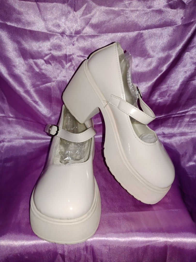 White Mary Jane Platform Heels with Buckle Strap (Category: Heels) located in Quezon City. Submitted by herlys.684 (Listing ID 1470258889, Image 3). Description: 💫 worn once 📏 Size: 38 📍 Loc: QC payatas 🍒 Style: Chunky platform Mary Janes with thick block heels and round toes 🍒 Finish: Glossy patent white 🍒 Details: Buckle strap across the top 🍒 Condition: Pristine! Clean soles and insoles, plastic stuffing still inside toes to maintain sh