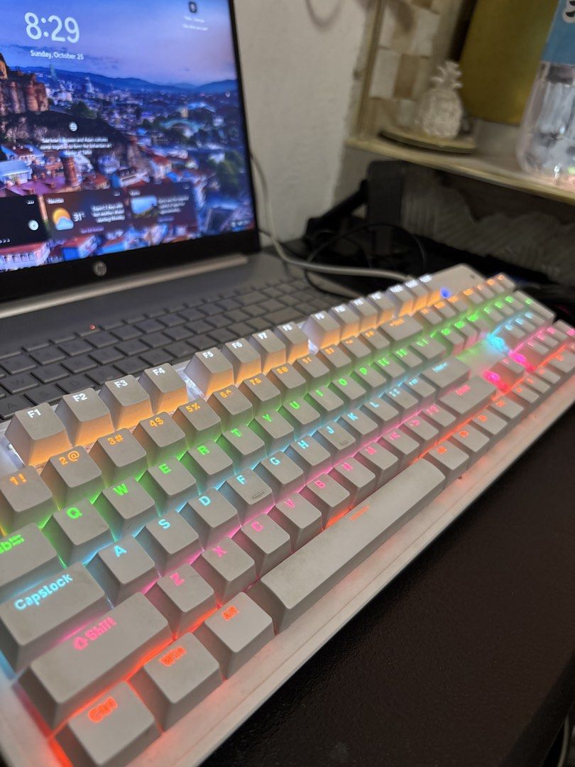 White Mechanical Gaming Keyboard with RGB Backlight (Category: Computer Keyboard) located in Malabon City. Submitted by luxgoals (Listing ID 1470144981, Image 1). Description: - Sleek white mechanical keyboard with matching white keys (104 keys) - Vibrant full RGB rainbow backlighting - Full-sized layout including a convenient numeric keypad - Modern compact design with stylish exposed switches - Reliable wired USB connection - Perfect for gaming