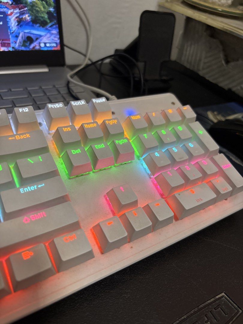 White Mechanical Gaming Keyboard with RGB Backlight (Category: Computer Keyboard) located in Malabon City. Submitted by luxgoals (Listing ID 1470144981, Image 3). Description: - Sleek white mechanical keyboard with matching white keys (104 keys) - Vibrant full RGB rainbow backlighting - Full-sized layout including a convenient numeric keypad - Modern compact design with stylish exposed switches - Reliable wired USB connection - Perfect for gaming