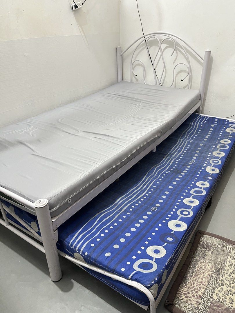 White Metal Single Bed Frame with Pull-Out and Mattresses (Category: Bed Frames & Mattresses) located in San Mateo. Submitted by kimmie36512 (Listing ID 1470293762, Image 1). Description: - White metal single bed frame with pull-out - with two mattresses (Uratex) - pull out bed frame is already bent - pls manage your expectation .