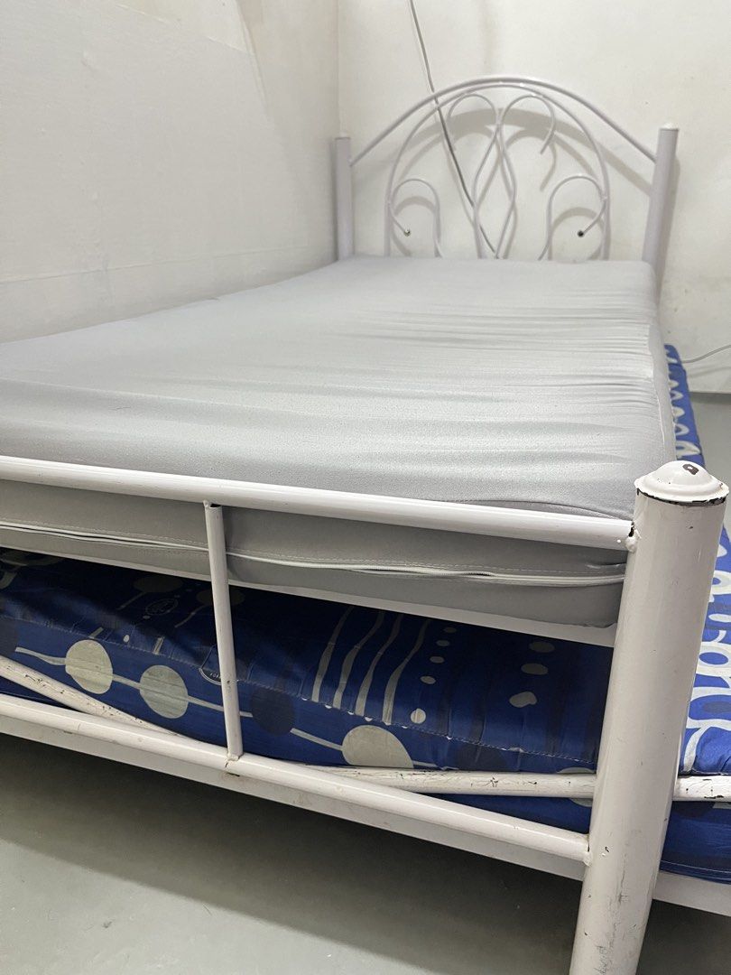 White Metal Single Bed Frame with Pull-Out and Mattresses (Category: Bed Frames & Mattresses) located in San Mateo. Submitted by kimmie36512 (Listing ID 1470293762, Image 3). Description: - White metal single bed frame with pull-out - with two mattresses (Uratex) - pull out bed frame is already bent - pls manage your expectation .