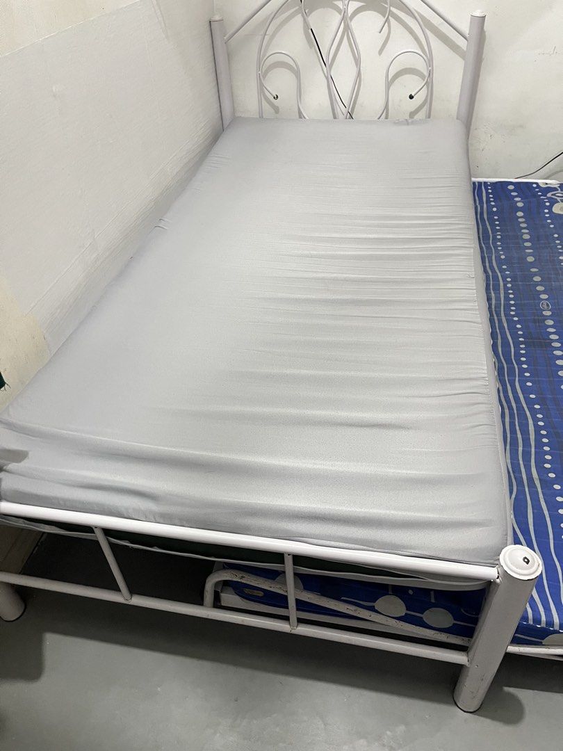 White Metal Single Bed Frame with Pull-Out and Mattresses (Category: Bed Frames & Mattresses) located in San Mateo. Submitted by kimmie36512 (Listing ID 1470293762, Image 2). Description: - White metal single bed frame with pull-out - with two mattresses (Uratex) - pull out bed frame is already bent - pls manage your expectation .