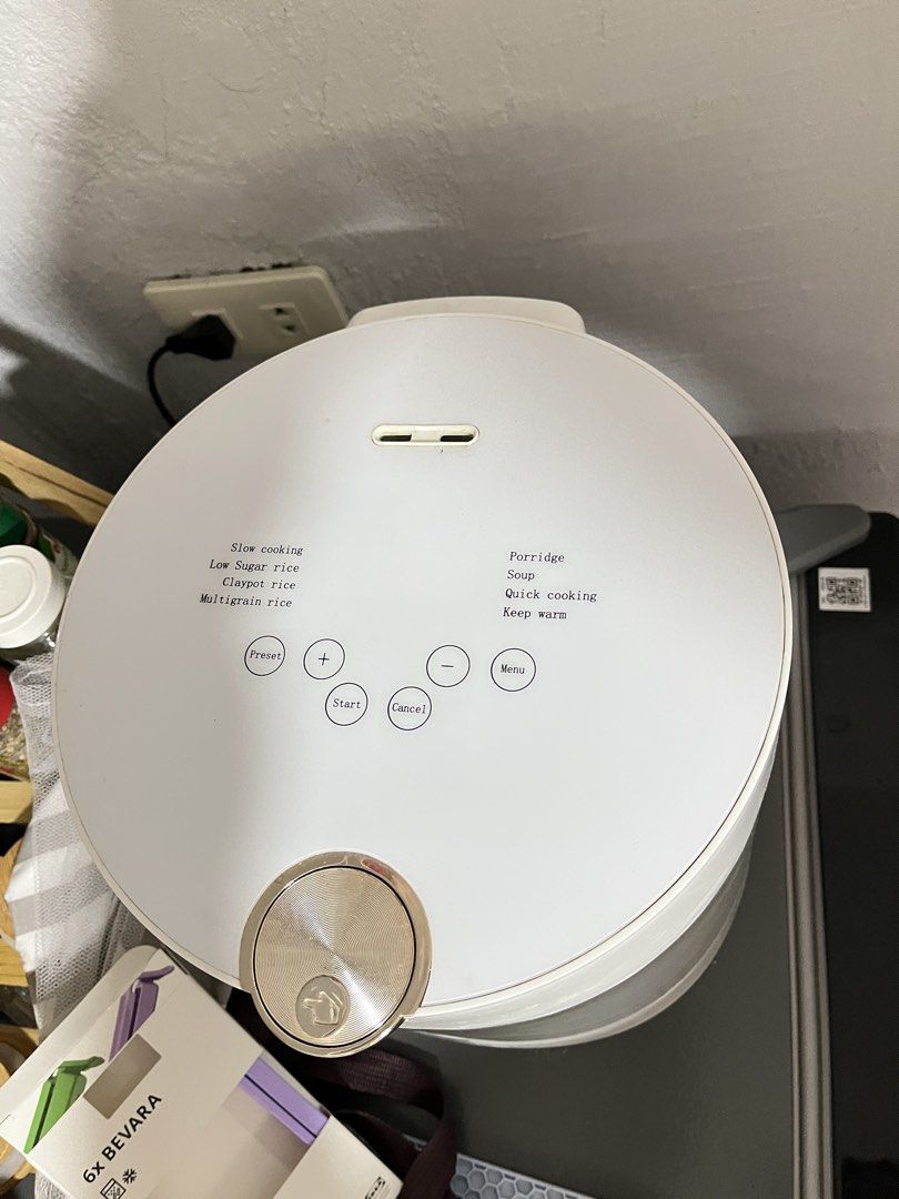 White Multi-Function Rice Cooker with Low Sugar Setting (Category: Cookers) located in Manila. Submitted by curated.clutter12 (Listing ID 1470150761, Image 2). Description: - Color/Design: Clean, modern white design - Control Panel: Digital top panel with preset, start, cancel, and menu options - Cooking Modes: Slow cooking, low sugar rice, claypot rice, multigrain, porridge, soup, quick cooking, and keep warm - Features: Clear front measuring wi