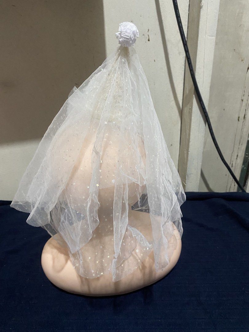 White Party Hat Headband with Veil (Category: Hair Accessories) located in Manila. Submitted by resi.diaz (Listing ID 1470324470, Image 3). Description: White headband with a sparkly cone hat and attached tulle veil. Features iridescent sequins on the hat and bow, pearls along the base, and a small pom-pom at the tip. Comfortable white fabric band..