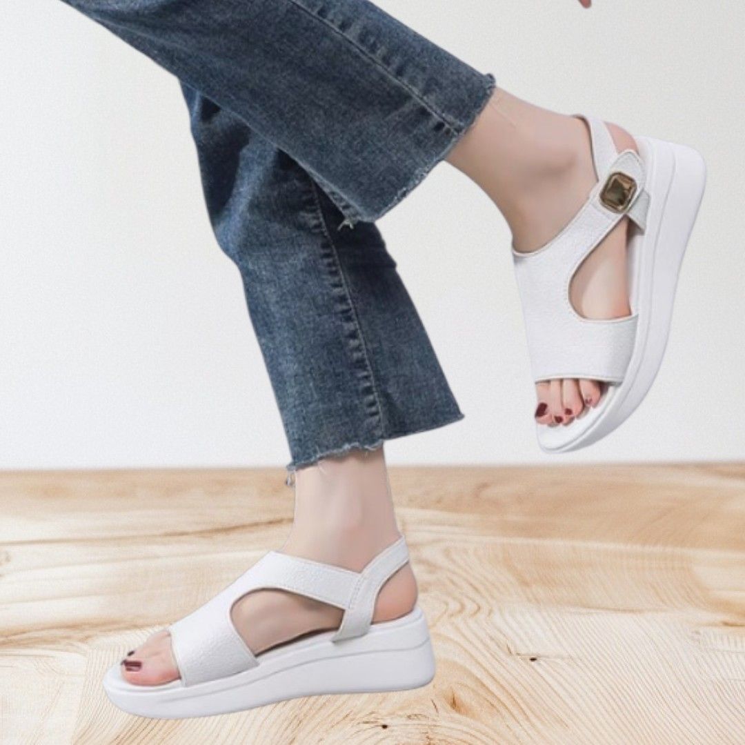 White Sandals (Category: Flats & Sandals) located in Mangaldan. Submitted by closetqwin (Listing ID 1470199770, Image 1). Description: - Color: Clean white - See 2nd picture for measurements - Material: Synthetic leather upper - Design: Chunky platform sole with a comfortable wedge heel - Closure: Gold-tone buckle on the ankle strap - Styling: Versatile design that matches shorts, jeans, and summer dresses.
