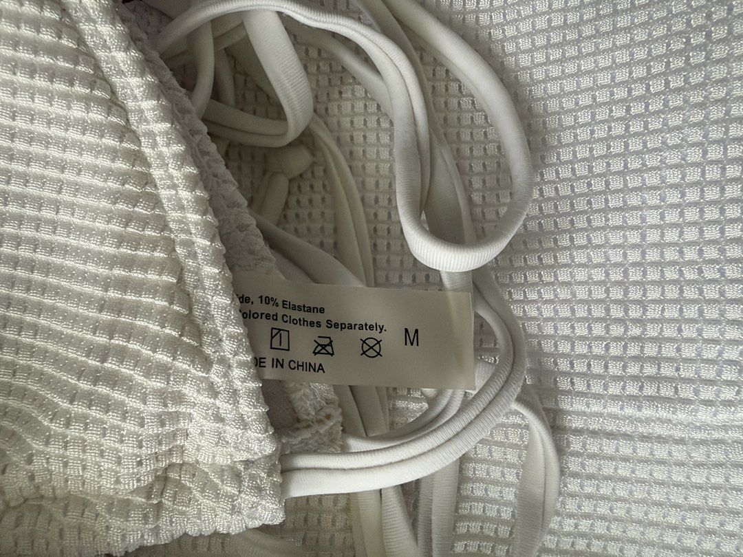 White Textured Bikini Set With Shorts Size M (Category: Bikinis & Swimsuits) located in Dinalupihan. Submitted by wonmeoww (Listing ID 1470252277, Image 2). Description: - Style: White two-piece swimsuit set with triangle halter top and high-waisted shorts - Size: Medium - Condition: Clean and well-maintained.