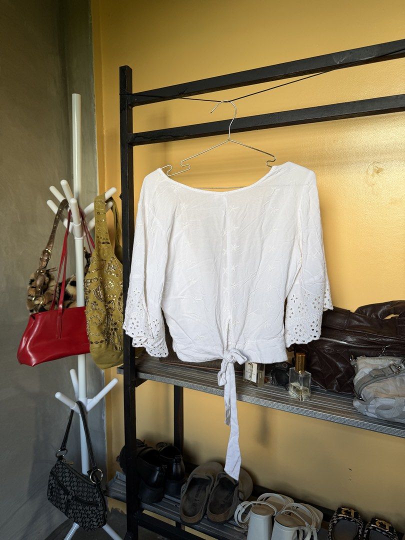 White Wrap Crop Blouse (Category: Blouses) located in Legazpi City. Submitted by hapie_haus (Listing ID 1470272967, Image 2). Description: P 149 Piece 1 Color: White ;Wrap top with front waist tie with Beautiful embroidered pattern P 100 Piece 2- Pairing with maroon high-waisted shorts .