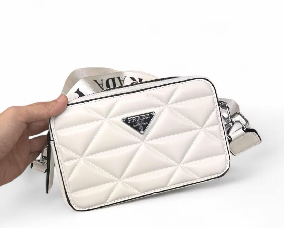 Wholesale price Camera Bag (Category: Camera Bags & Carriers) located in Bulacan. Submitted by tytoluxe (Listing ID 1470246371, Image 2). Description: Camera bag Minimum purchase of 2 off per order P- 385 pesos Mk- 400 pesos G - 330 pesos - Stylish quilted geometric pattern with front triangle logo plaque - Dual zippered main compartments for secure storage - Trendy wide branded shoulder strap with clip-on hardware - Structured rectangular shape 
