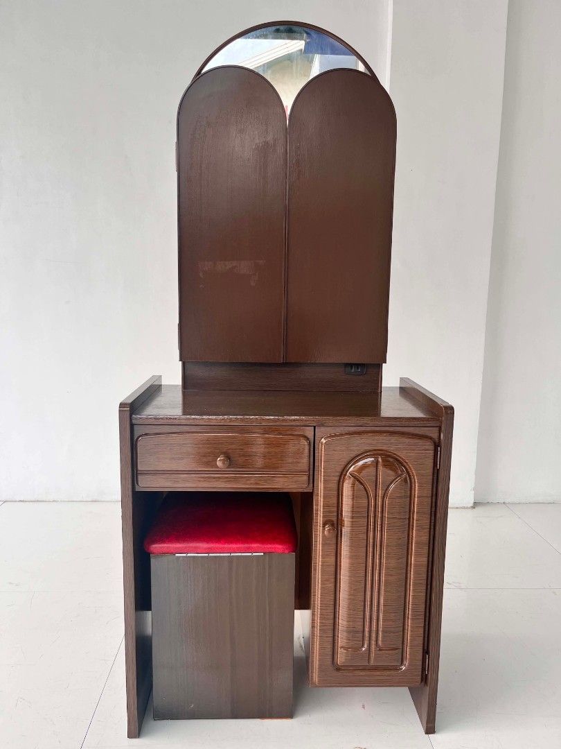 Wooden Vanity Dressing Table with Tri-Fold Mirror and Stool (Category: Tables & Sets) located in Manila. Submitted by roveeeeelen_06 (Listing ID 1470169910, Image 3). Description: - Brown wooden vanity set with a smooth polished finish - Large adjustable tri-fold mirror setup - Includes a matching stool with a comfortable red cushioned top - Ample storage: pull-out drawer on the left and a shelved cabinet on the right - Sturdy structure with clea