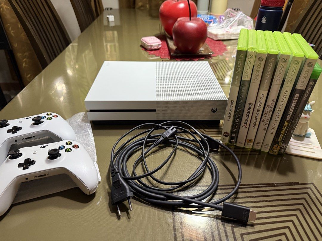 Xbox One S Bundle with Controllers and Games (Category: Xbox) located in Bulacan. Submitted by jmfranco_1101_newer (Listing ID 1470221080, Image 1). Description: - White Xbox One S console in clean condition with all back ports intact - Includes 2 white wireless controllers complete with thumbsticks and button pads (one is bnew) - Power cable and HDMI cable included - Comes with 8 popular games: Dragon Age II, Dragon Age Inquisition, Prototype 2,