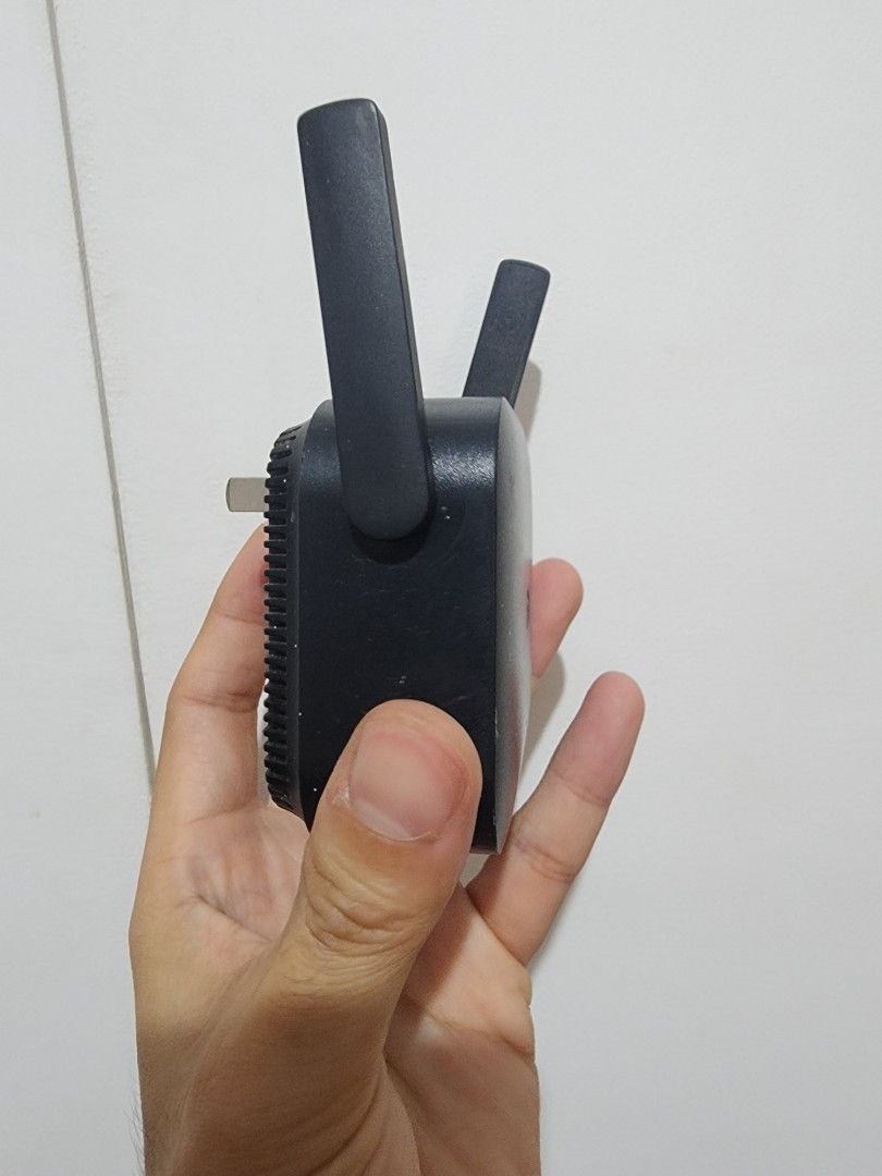Xiaomi WiFi Range Extender Pro (Category: Networking) located in Meycauayan. Submitted by MP_Shop (Listing ID 1470157181, Image 2). Description: - Model: Xiaomi Wi-Fi Repeater Pro R03 (Black) - Condition: Used, 100% working normally - Coverage: Dual external antennas to boost wireless signals across rooms - Convenience: Direct wall socket plug-in with a compact design - Setup: Quick and easy via the Mi Home app.