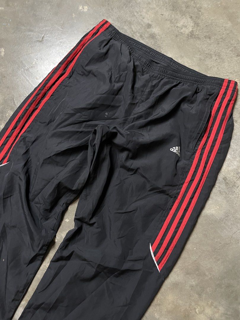 [Y2K/BLOCKCORE] Authentic 2008 Adidas Black & Red 3-Stripes Track Pants (Category: Joggers) located in Caloocan City. Submitted by piecesgarments (Listing ID 1470165447, Image 3). Description: Authentic vintage 2008 Adidas Clima365 track pants! Features a lightweight matte black shell contrasted with bold crimson red 3-Stripes, silver reflective piping trim, embroidered logo on the hip, ankle leg zippers, and full interior mesh lining. DETAILS: •