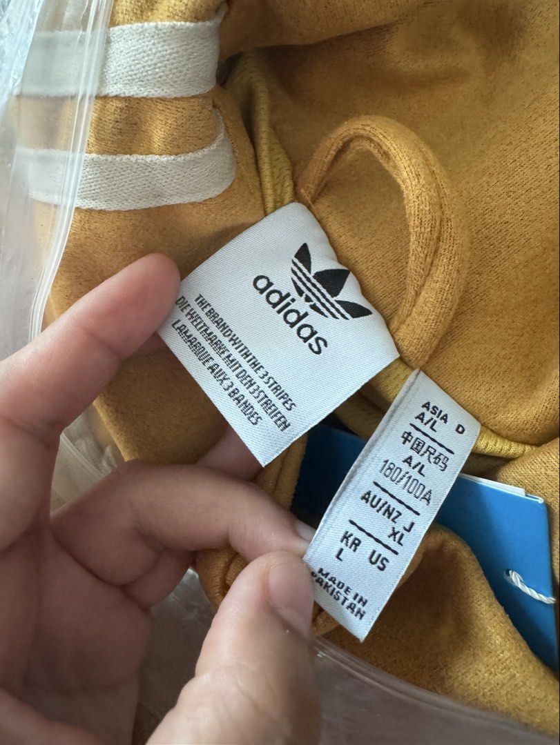Yellow Chinese New Year Jacket (Category: Coats, Jackets and Outerwear) located in Manila. Submitted by nothingandeverything (Listing ID 1470232442, Image 2). Description: - From Shanghai, China - Style: Chinese New Year Jacket - Details: Embroidered trefoil logo on the chest and high collar - Condition: Brand new with tags (BNWT), never worn - Origin: Made in Pakistan - Unisex - Negotiable Also available in Burgundy (L) and Blue (M) color.