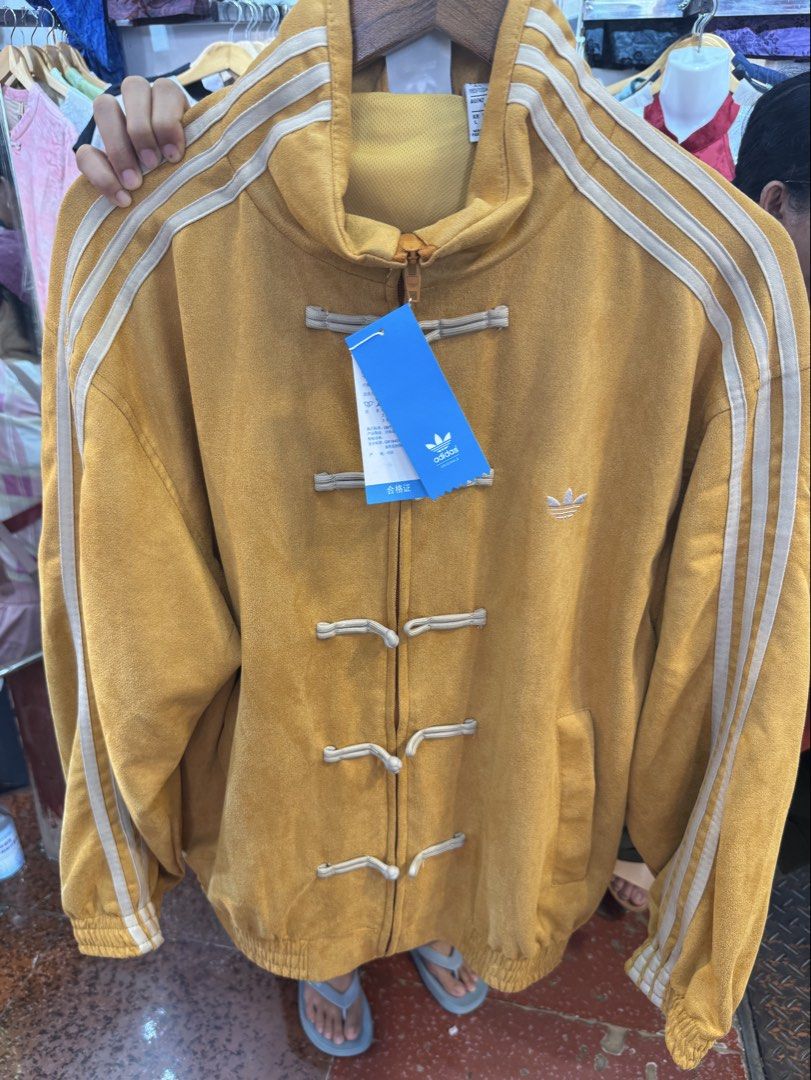 Yellow Chinese New Year Jacket (Category: Coats, Jackets and Outerwear) located in Manila. Submitted by nothingandeverything (Listing ID 1470232442, Image 1). Description: - From Shanghai, China - Style: Chinese New Year Jacket - Details: Embroidered trefoil logo on the chest and high collar - Condition: Brand new with tags (BNWT), never worn - Origin: Made in Pakistan - Unisex - Negotiable Also available in Burgundy (L) and Blue (M) color.