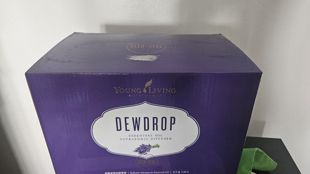 Young Living Dewdrop Essential Oil Ultrasonic Diffuser (Category: Home Fragrance) located in Manila. Submitted by lenzp (Listing ID 1470163046, Image 1). Description: - FREE DELIVERY WITHIN MANILA OR QC - Authentic Young Living Dewdrop Ultrasonic Essential Oil Diffuser - Includes original purple box - Water reservoir capacity: 180 ml - Coverage area: ~323 sq. ft. / 30 sq. meters - Compact dimensions: 13.5 x 13.5 x 19 cm (~6.3 x 5.3 x 7.5 inches) 