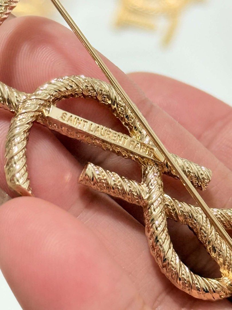 YSL brooch (Category: Other Accessories) located in Cebu City. Submitted by simpleabundance (Listing ID 1470240035, Image 2). Description: with markings gold tone.