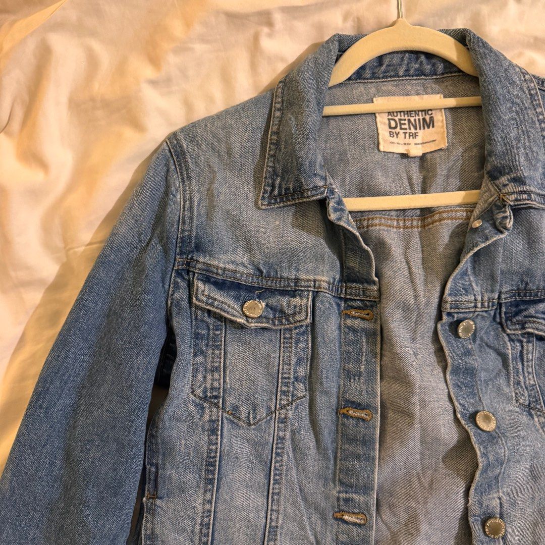 Zara Authentic Denim by TRF Jacket (Category: Coats, Jackets and Outerwear) located in Quezon City. Submitted by ianne.declutter (Listing ID 1470176679, Image 3). Description: - Brand: Zara TRF - Wash: Light wash denim - Closure: Button-up front with metal buttons - Pockets: Functional chest flap pockets - Cuffs: Button cuffs - Style: Classic casual staple, ideal for layering over tees or hoodies.