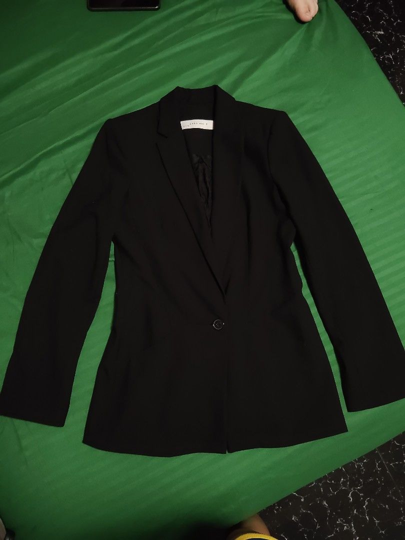 Zara Basic Black Blazer Size S (Category: Coats, Jackets and Outerwear) located in Batangas. Submitted by ms.d_preloveditems (Listing ID 1470283039, Image 2). Description: - Brand: Zara Basic - Size: Small (EUR, USA, MEX sizing on tag) but can fit up to medium - Color: Black - Origin: Made in Spain - Design: Lapel collar with single-button front closure - Fit: Structured fit through the waist - Lining: Fully lined inside - Condition: Excellent pr