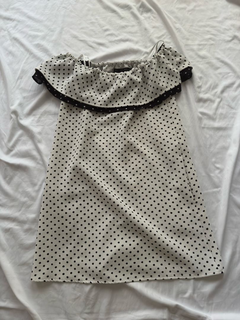 Zara Basic Polka Dot Off-Shoulder Dress XS (Category: Dresses) located in Cebu City. Submitted by _t.rix (Listing ID 1470181614, Image 1). Description: - Style: White mini dress with all-over black polka dots - Design: Off-shoulder neckline with a trendy ruffled overlay - Fit: Elasticated top for comfortable wear, lightweight fabric - Origin: Made in Spain - Size: EUR XS, USA XS, MEX 24.