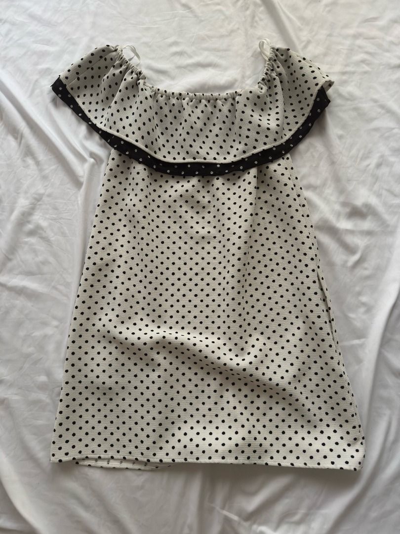 Zara Basic Polka Dot Off-Shoulder Dress XS (Category: Dresses) located in Cebu City. Submitted by _t.rix (Listing ID 1470181614, Image 3). Description: - Style: White mini dress with all-over black polka dots - Design: Off-shoulder neckline with a trendy ruffled overlay - Fit: Elasticated top for comfortable wear, lightweight fabric - Origin: Made in Spain - Size: EUR XS, USA XS, MEX 24.