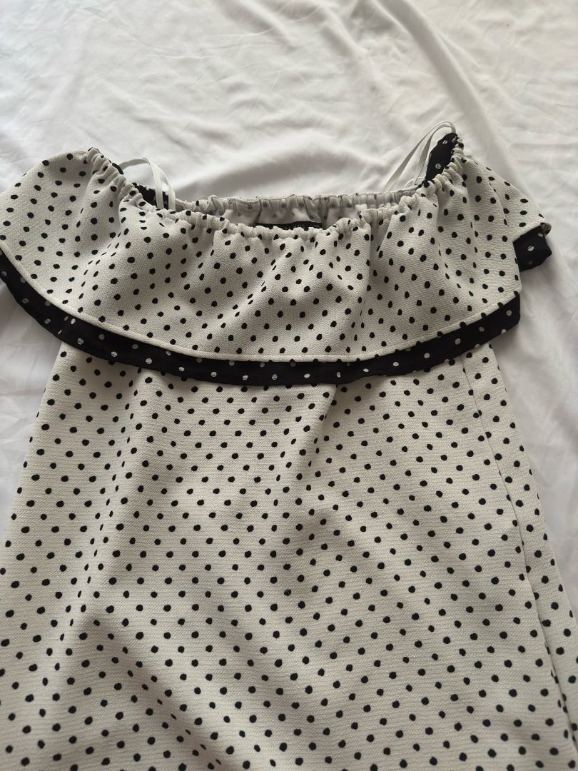 Zara Basic Polka Dot Off-Shoulder Dress XS (Category: Dresses) located in Cebu City. Submitted by _t.rix (Listing ID 1470181614, Image 2). Description: - Style: White mini dress with all-over black polka dots - Design: Off-shoulder neckline with a trendy ruffled overlay - Fit: Elasticated top for comfortable wear, lightweight fabric - Origin: Made in Spain - Size: EUR XS, USA XS, MEX 24.