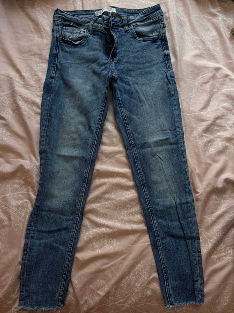 Zara Basic Z1975 Denim Skinny Jeans (Category: Jeans) located in Santa Rosa. Submitted by shopaholicscastle (Listing ID 1470186192, Image 1). Description: - Brand/Model: Zara Basic Z1975 - Style: Denim skinny jeans with a flattering mid-rise fit - Wash: Medium blue wash - Details: Trendy raw frayed hem at the ankles - Pockets: Classic five-pocket styling - Closure: Zip fly and button closure - Branding: Brown leather-look patch at the back waist.