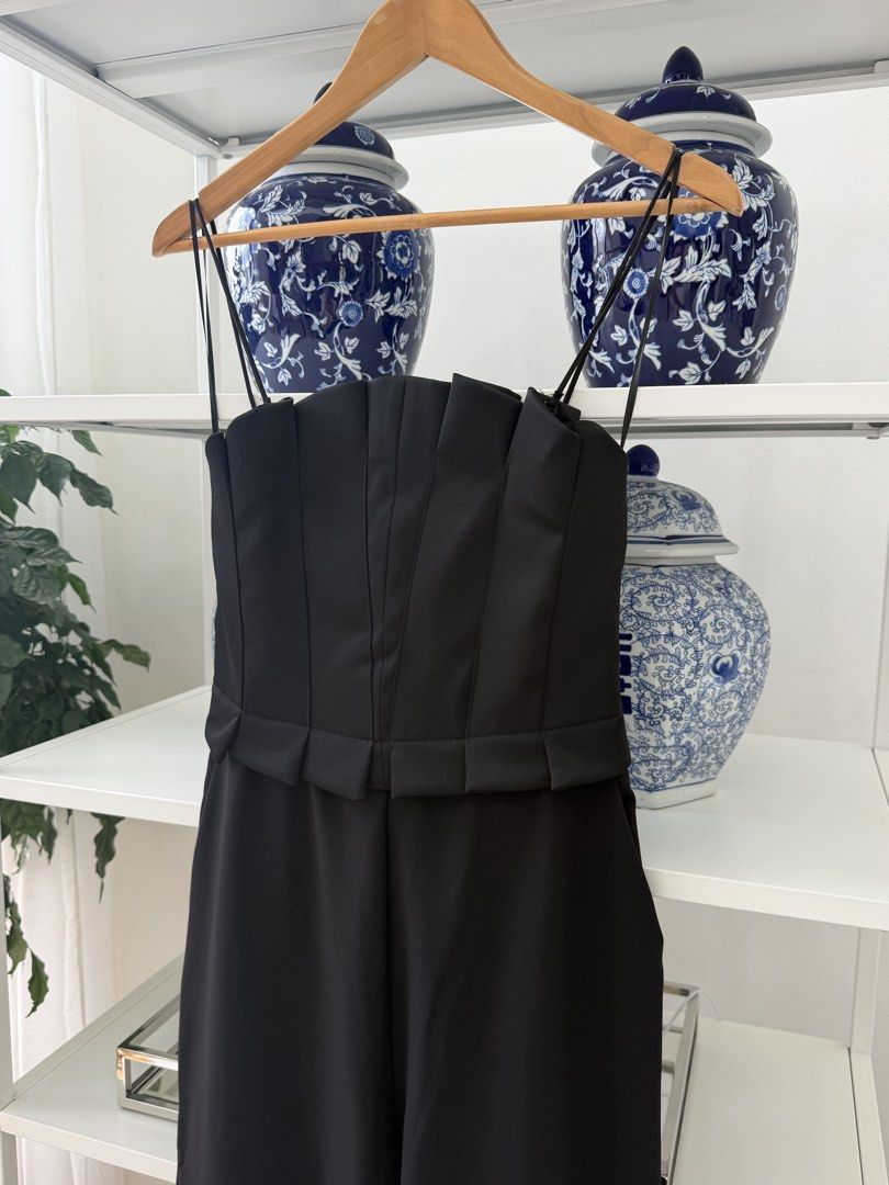 Zara Black Strapless Jumpsuit Size S (Category: Jumpsuits) located in Lipa City. Submitted by pauline0303 (Listing ID 1470174741, Image 2). Description: - Brand: Zara - Style: Strapless wide-leg jumpsuit with optional thin spaghetti straps - Size: Small (S) - Color: Classic Black - Features: Structured bodice, elegant pleating details, and secure back zipper closure, side pockets - Condition: Brand new with original tags attached (BNWT), never wo