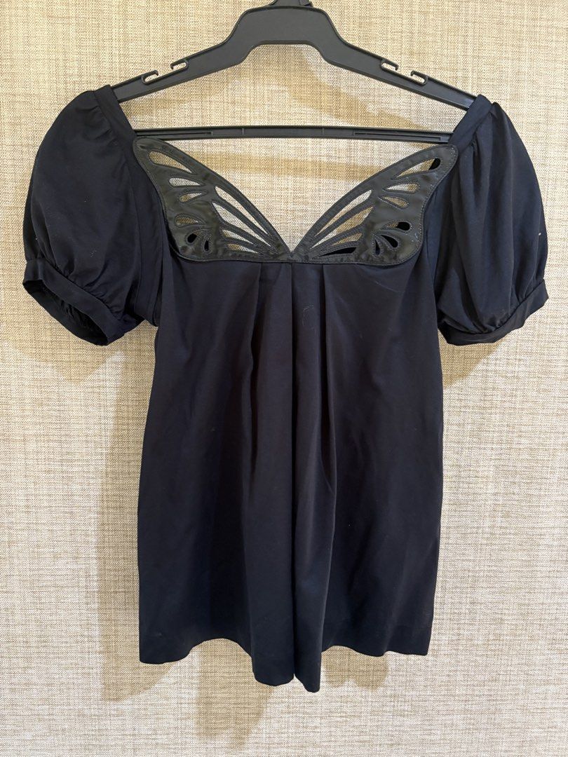 Zara Collection Butterfly Wing Neckline (Category: Blouses) located in Muntinlupa City. Submitted by jane226ph (Listing ID 1470134844, Image 1). Description: Original Zara Collection Black Unique shiny cut-out butterfly wing details at the front, short puff sleeves, pleated. Bought in Spain Purchased in-store An older collection of Zara. Rare design..