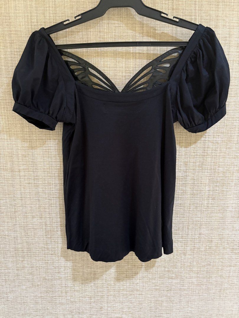 Zara Collection Butterfly Wing Neckline (Category: Blouses) located in Muntinlupa City. Submitted by jane226ph (Listing ID 1470134844, Image 2). Description: Original Zara Collection Black Unique shiny cut-out butterfly wing details at the front, short puff sleeves, pleated. Bought in Spain Purchased in-store An older collection of Zara. Rare design..