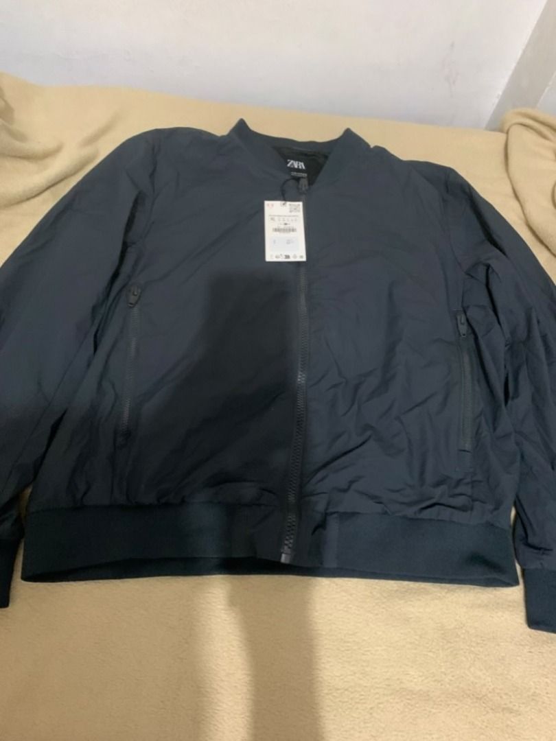 BNWT zara bomber jacket dark navy (Category: Coats, Jackets and Outerwear) located in Makati City. Submitted by santanajdd (Listing ID 1470280228, Image 1). Description: Brand: Zara Item: Lightweight Zip-Up Bomber Jacket Color: Dark Navy / Blue-Grey Size: Extra Large (XL / EUR XL / US XL) Condition: 10/10 BRAND NEW WITH TAGS (BNWT) — Never worn, store tag still attached Features: • Sleek bomber jacket design with ribbed collar, hem, and cuffs • F