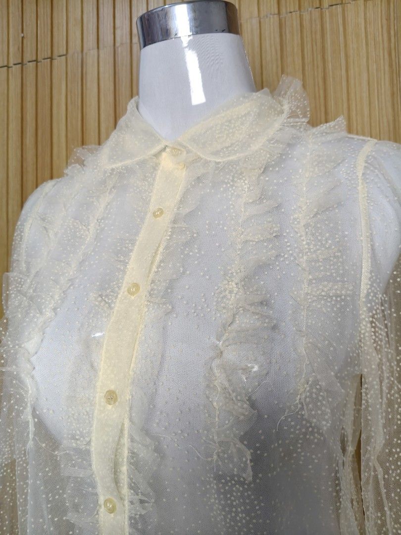 Zara Sheer Polka Dot Ruffle Blouse (Category: Blouses) located in Taguig. Submitted by ashie_clothing (Listing ID 1470321225, Image 3). Description: - Brand: Zara - Condition: Brand new with original tags attached (Never worn) - Size: XS - Color: Light beige / cream - Material/Design: Sheer mesh with tiny polka dots - Details: Delicate ruffles down the front placket, collar, and cuffs - Closure: Button-down front - Perfect for: Office wear, dates