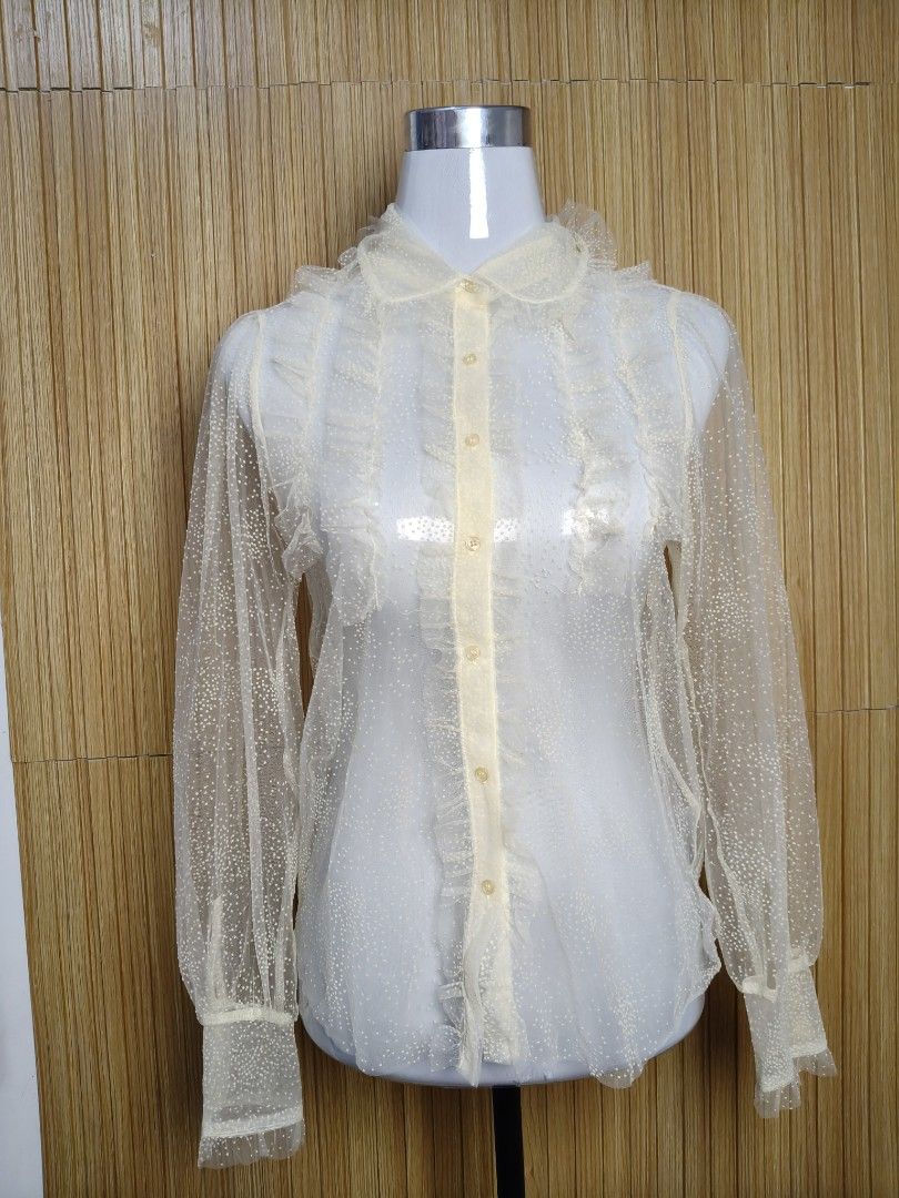 Zara Sheer Polka Dot Ruffle Blouse (Category: Blouses) located in Taguig. Submitted by ashie_clothing (Listing ID 1470321225, Image 2). Description: - Brand: Zara - Condition: Brand new with original tags attached (Never worn) - Size: XS - Color: Light beige / cream - Material/Design: Sheer mesh with tiny polka dots - Details: Delicate ruffles down the front placket, collar, and cuffs - Closure: Button-down front - Perfect for: Office wear, dates