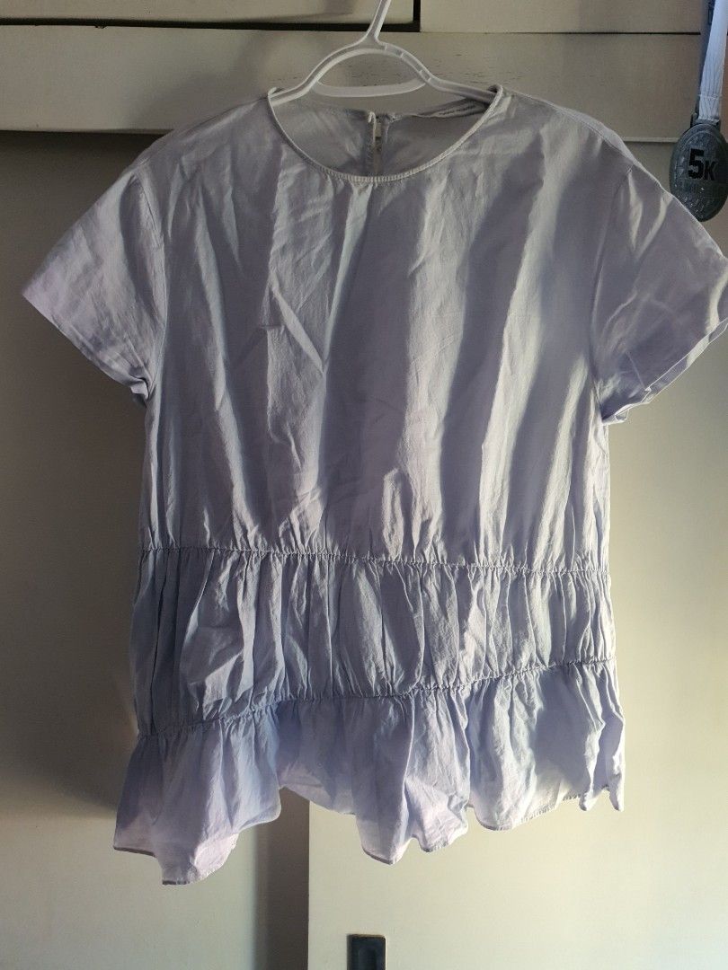 Zara Trafaluc Collection Light Blue Ruffled Blouse Size S (Category: Blouses) located in Paranaque City. Submitted by love_opaque (Listing ID 1470224280, Image 1). Description: - Brand: Zara Trafaluc - Size: EUR S / USA S / MEX 26 (Relaxed fit) - Color: Light Blue - Material/Design: Textured fabric with horizontal smocked ruffling on midsection and lower tier - Neckline: Round neck with cute fabric-covered button-down back closure - Condition: Ex