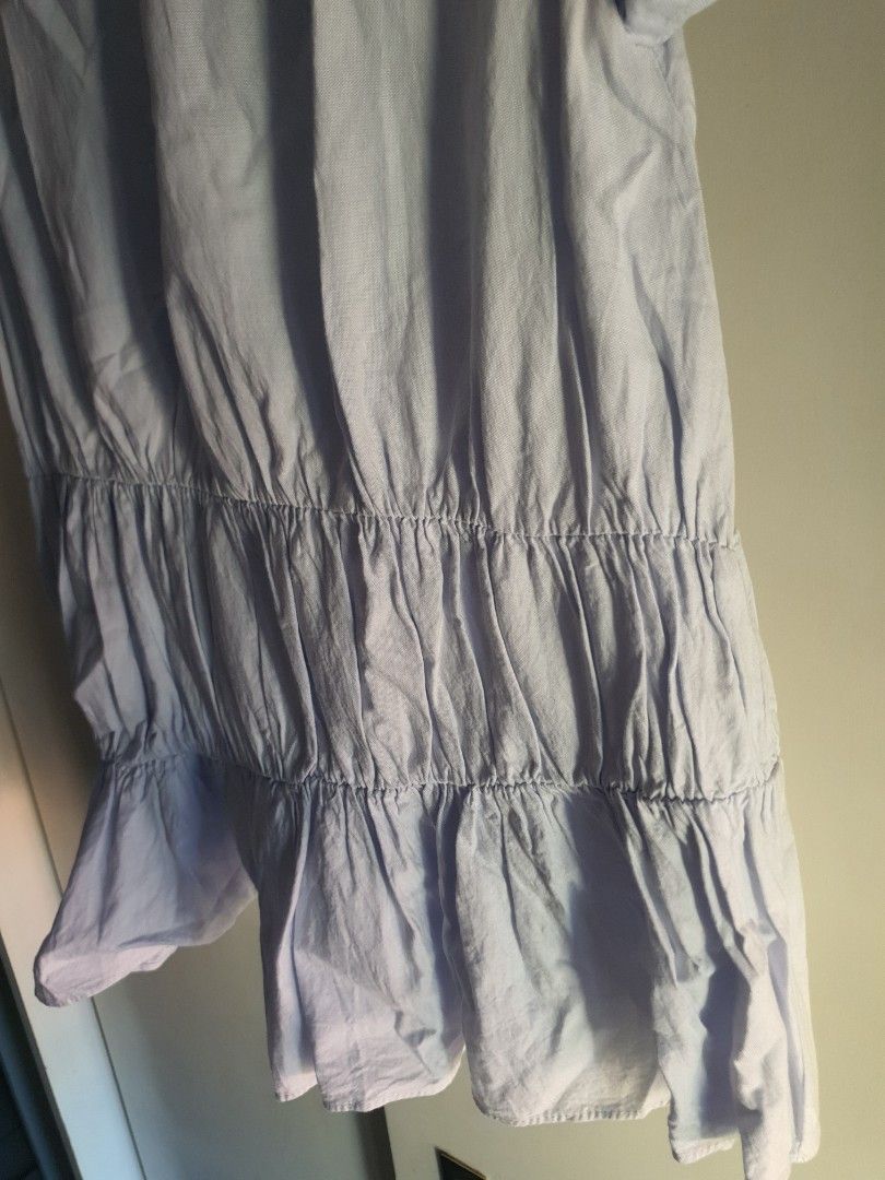 Zara Trafaluc Collection Light Blue Ruffled Blouse Size S (Category: Blouses) located in Paranaque City. Submitted by love_opaque (Listing ID 1470224280, Image 2). Description: - Brand: Zara Trafaluc - Size: EUR S / USA S / MEX 26 (Relaxed fit) - Color: Light Blue - Material/Design: Textured fabric with horizontal smocked ruffling on midsection and lower tier - Neckline: Round neck with cute fabric-covered button-down back closure - Condition: Ex