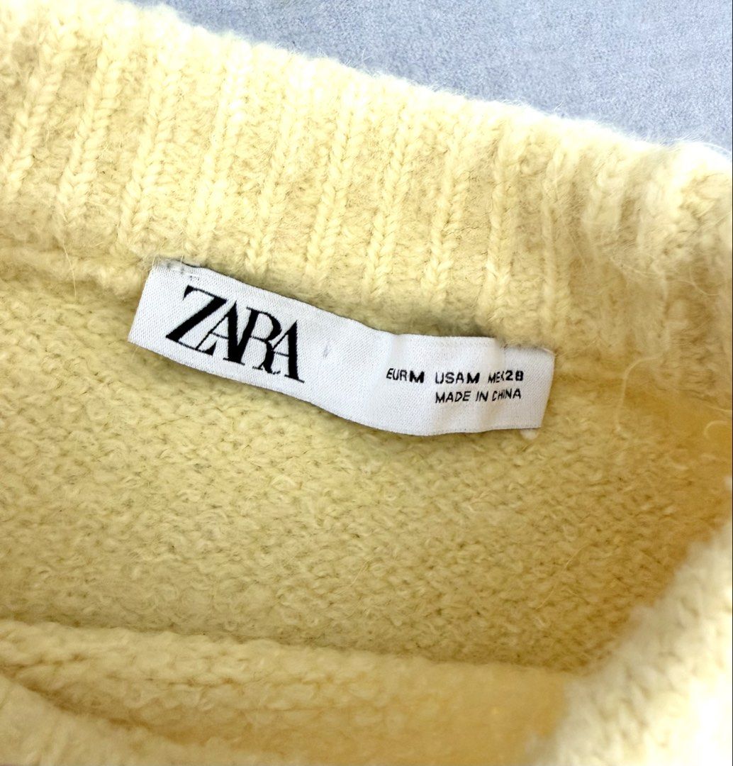 Zara Yellow Knit Sweater Medium (Category: Longsleeves) located in Lipa City. Submitted by pauline0303 (Listing ID 1470178888, Image 3). Description: - Brand: Zara - Size: EUR M / USA M - Color: Butter yellow - Material/Texture: Soft, fuzzy knit - Design: Crew neck with ribbed collar, cuffs, and hem - Origin: Made in China - Condition: Great staple piece for cooler weather, pairs easily with jeans.