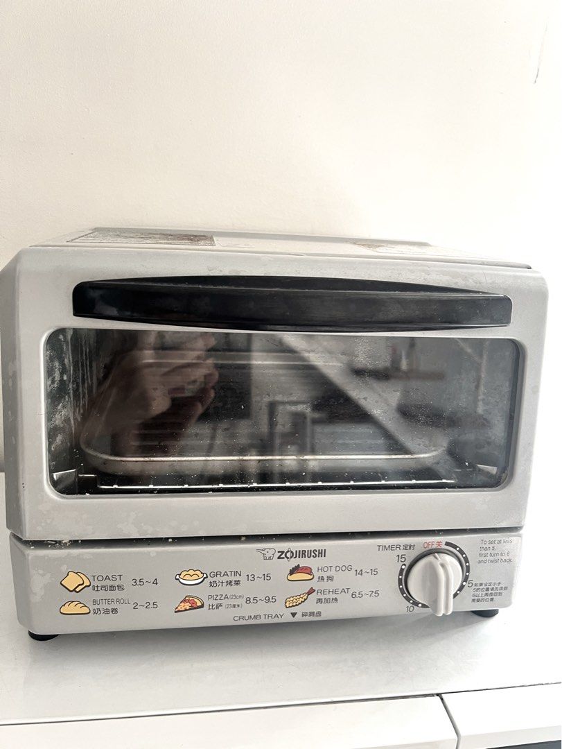Zojirushi Mini Oven Toaster (Category: Ovens & Toasters) located in Taguig. Submitted by fifileen (Listing ID 1470345683, Image 1). Description: - Authentic Zojirushi mini oven toaster in sleek grey with a black door handle - 15-minute timer dial for precise cooking control - Convenient graphic guides on the front panel for toast, pizza, gratin, and more - Removable crumb tray at the bottom for easy cleaning - Fully working condition, ideal for q
