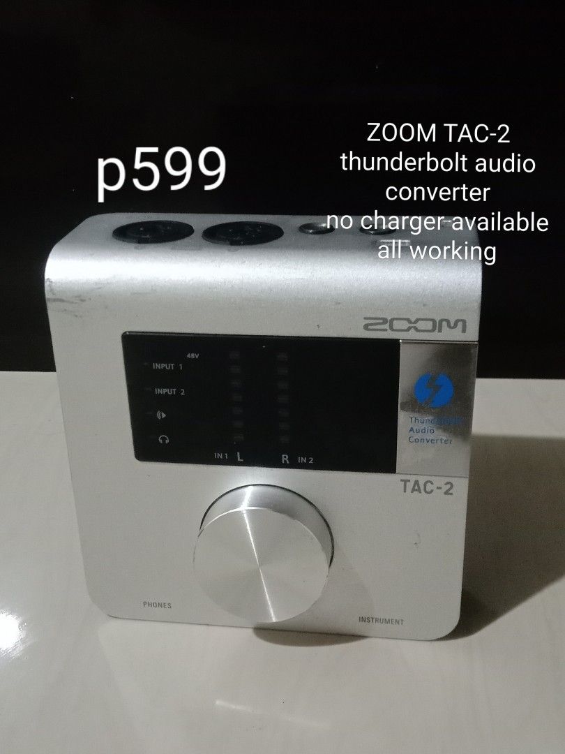 Zoom TAC-2 Thunderbolt Audio Converter (Category: Cables & Adaptors) located in Manila. Submitted by redvincent01640 (Listing ID 1470285621, Image 1). Description: - Item: Zoom TAC-2 Thunderbolt Audio Converter (Silver) - Condition: Fully functional, powers on normally with minor cosmetic scuffs from regular use - Features: Large central volume knob, dual inputs on top, and standard rear connection ports - Inclusion: Unit only (charger/power adap