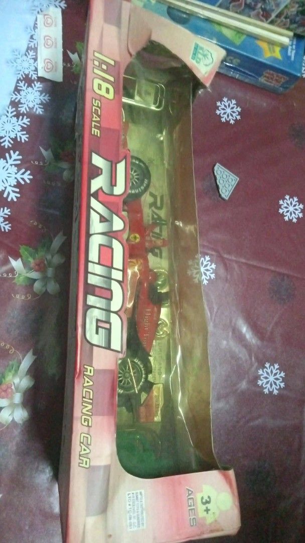 1:18 Scale Red Racing Car Toy (Category: Vehicle & Diecast Models) located in Manila. Submitted by wisegem-231b (Listing ID 1470397606, Image 3). Description: - Scale: 1:18 - Type: Friction-powered red racing car - Condition: Brand new, toy is untouched inside - Packaging: Box has minor wear on edges and corners, with transparent windows on front and top - Ideal for: Toy vehicle collections.