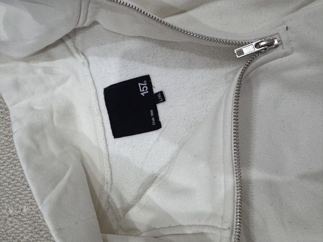 157 Half Zip Sweatshirt Off White L/XL (Category: Coats, Jackets and Outerwear) located in Valenzuela. Submitted by crabncorn (Listing ID 1470362278, Image 3). Description: - Brand/Era: 157 (Established 1999) - Color: Off-white - Size: L/XL - Material/Feel: Thick fleece lining inside, super cozy and warm - Features: Metal zipper pull on the front collar, ribbed cuffs and hem - Flaw: One purple ink stain near the right shoulder seam (please check 