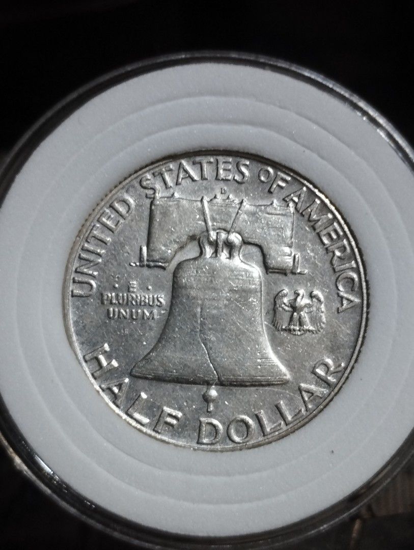 1960 D Benjamin Franklin Half Dollar US Silver Coin (Category: Currency) located in Quezon City. Submitted by pureblood_134 (Listing ID 1470443850, Image 2). Description: - Authentic 1960-D Half Dollar featuring Benjamin Franklin - Features the Denver mint mark above the Liberty Bell on the reverse - High-value 90% silver composition - Safely housed in a durable protective circular capsule holder - Perfect addition to any coin collection or numis