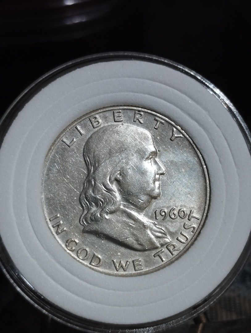 1960 D Benjamin Franklin Half Dollar US Silver Coin (Category: Currency) located in Quezon City. Submitted by pureblood_134 (Listing ID 1470443850, Image 1). Description: - Authentic 1960-D Half Dollar featuring Benjamin Franklin - Features the Denver mint mark above the Liberty Bell on the reverse - High-value 90% silver composition - Safely housed in a durable protective circular capsule holder - Perfect addition to any coin collection or numis