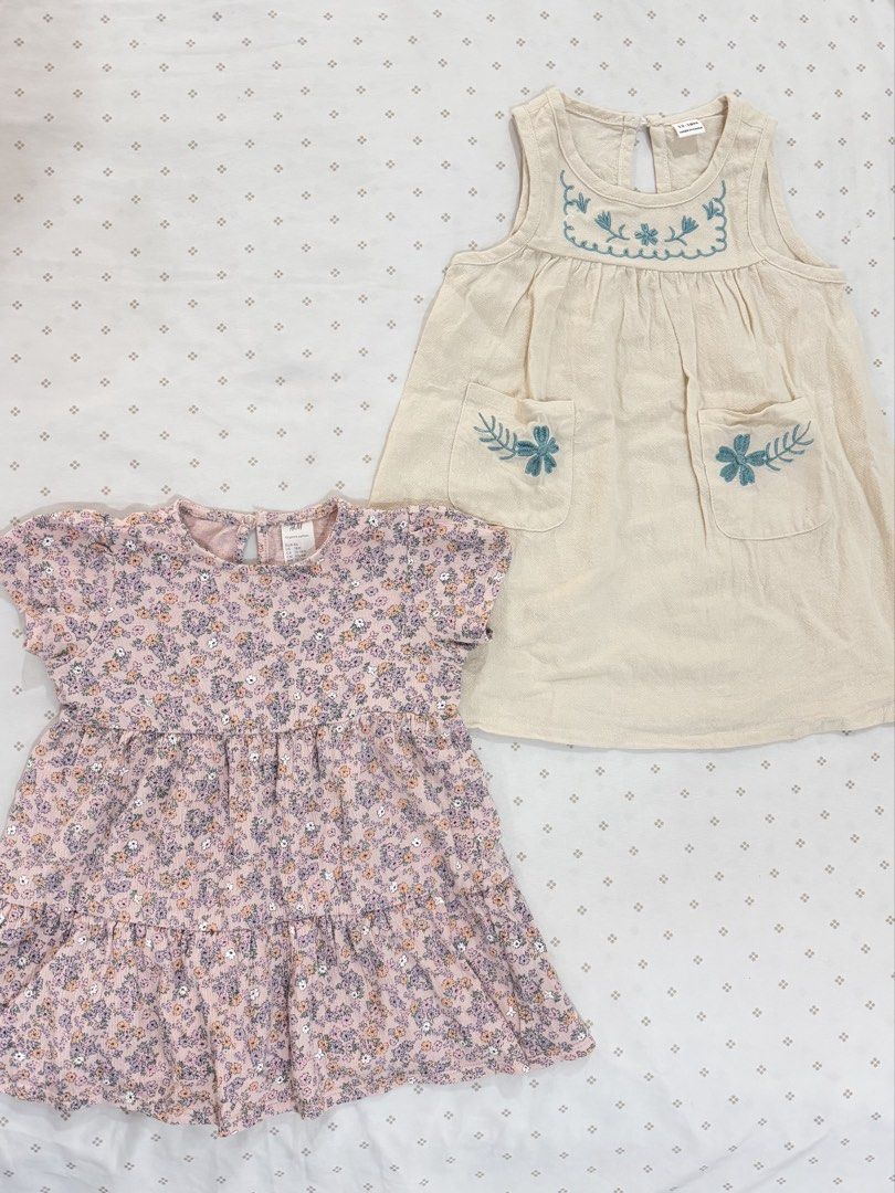 2 Dresses Set (12-18M) (Category: Babies & Kids Fashion) located in Manila. Submitted by diane.preloved0328 (Listing ID 1470430205, Image 1). Description: H&M Floral Dress 12-18M Beige w Blue Flowers 12-18M.