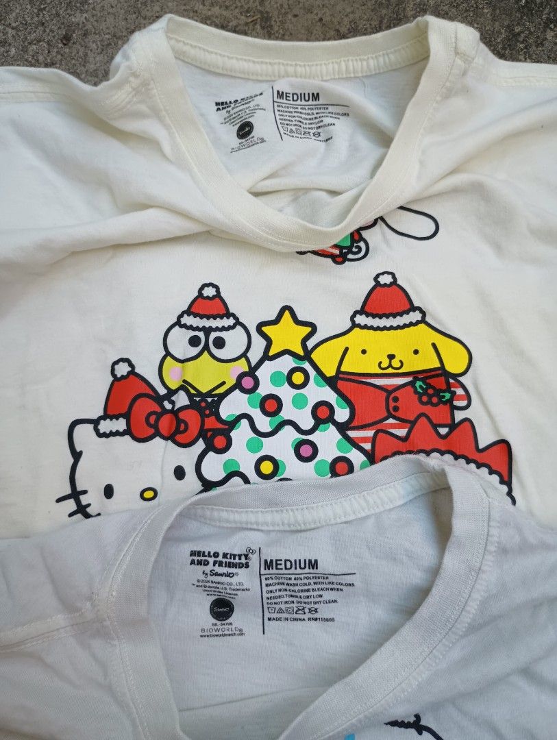 2 Hello Kitty Sanrio Tees (Category: Shirts) located in Las Pinas. Submitted by preloved_manila (Listing ID 1470435321, Image 2). Description: Official Sanrio Merch Medium.